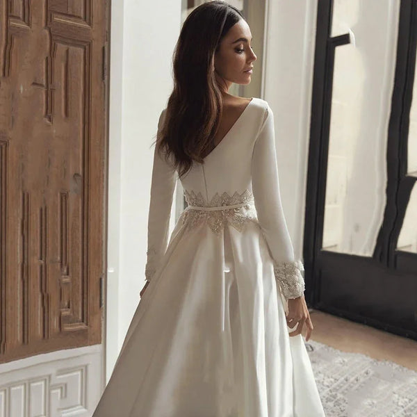 winter wedding dresses with fur trim There is something incredibly magical about a winter bride.  The lace  dress looked so soft in the cold light and the snow white cape with the  gentle fur trim made her
