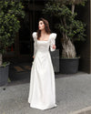 Vestido de novia de satén color marfil